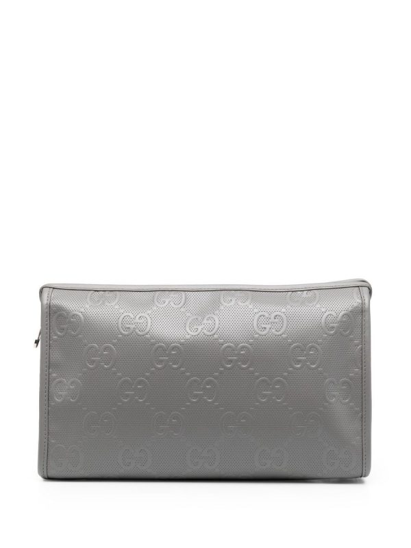 Gucci GG monogram-embossed clutch bag